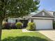 Charming single-Gathering home features a well-manicured lawn and attached two car garage at 2911 W Hawanian Ln, Monrovia, IN 46157