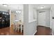 Well-lit kitchen, with a view of the dining area, featuring a black refrigerator and wood floors at 2911 W Hawanian Ln, Monrovia, IN 46157