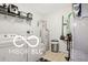 Functional laundry room with washer, dryer, shelving and ample storage space at 2911 W Hawanian Ln, Monrovia, IN 46157