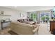 Bright living room with carpet, featuring modern furniture and sliding door access to outdoor space at 2911 W Hawanian Ln, Monrovia, IN 46157