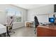 Bright office space with desk, chairs and large window for ample natural light at 2911 W Hawanian Ln, Monrovia, IN 46157