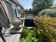 Cozy patio seating area with a grill surrounded by lush landscaping at 2911 W Hawanian Ln, Monrovia, IN 46157