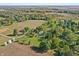 Aerial view highlights the property's layout, surrounding fields, and serene location at 2956 N 700 E, Franklin, IN 46131
