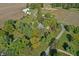 Aerial perspective showing the home's position amid lush trees and surrounding acreage at 2956 N 700 E, Franklin, IN 46131
