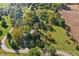 Aerial view showcasing the property's landscaping, surrounding greenery, and neighborhood at 2956 N 700 E, Franklin, IN 46131