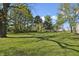 Expansive backyard with mature trees, offering plenty of space for outdoor activities at 2956 N 700 E, Franklin, IN 46131