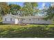 Backyard with mature trees and landscaping behind the house at 2956 N 700 E, Franklin, IN 46131