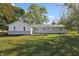 Expansive backyard with manicured lawn and plantings behind the house at 2956 N 700 E, Franklin, IN 46131