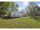 Spacious backyard with a well-maintained lawn and view of the back of the house at 2956 N 700 E, Franklin, IN 46131