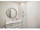Bathroom with a modern vanity, round mirror and white cabinets at 2956 N 700 E, Franklin, IN 46131