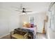 Bedroom featuring a ceiling fan, window, carpeted floor, double bed, bench and closet at 2956 N 700 E, Franklin, IN 46131