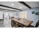 Cozy dining room leading into an open kitchen with wood table and seating for six at 2956 N 700 E, Franklin, IN 46131