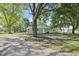 Gravel driveway leading to a ranch-style home surrounded by mature trees at 2956 N 700 E, Franklin, IN 46131