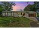 Inviting single-story brick home with lush green lawn, wooden door, and a well-maintained landscape at 2956 N 700 E, Franklin, IN 46131