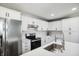 Bright kitchen featuring stainless steel appliances, white cabinets, a breakfast bar, and modern finishes at 2956 N 700 E, Franklin, IN 46131