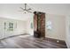 Bright living room featuring a brick fireplace, wood floors, and natural light at 2956 N 700 E, Franklin, IN 46131