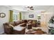 Cozy living room with a large sectional sofa, ceiling fan, and comfortable furnishings at 2956 N 700 E, Franklin, IN 46131
