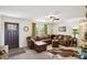 Inviting living room featuring a large sofa, neutral carpet, and lots of natural light at 2956 N 700 E, Franklin, IN 46131