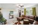 Warm living room featuring a comfortable sectional sofa, soft lighting, and stylish decor at 2956 N 700 E, Franklin, IN 46131