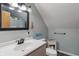 Bathroom featuring a vanity with a black-framed mirror and a tile-topped cabinet at 3631 S 450 E, Whitestown, IN 46075