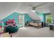 Bright bedroom features a beanbag chair, sloped ceilings, and a large window for natural light at 3631 S 450 E, Whitestown, IN 46075