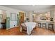 Bright dining area with wooden floors and natural light near the adjacent kitchen with modern appliances at 3631 S 450 E, Whitestown, IN 46075