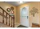 Welcoming entryway featuring a wooden staircase and decorative wall accents at 3631 S 450 E, Whitestown, IN 46075
