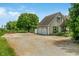 Home exterior featuring a two-car garage and large driveway at 3631 S 450 E, Whitestown, IN 46075