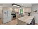Well-lit kitchen boasts modern appliances, ample counter space, and bright, neutral cabinets at 3631 S 450 E, Whitestown, IN 46075