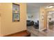 Open-concept living space featuring hardwood floors with bench seating, and a glimpse of the Kitchen at 3631 S 450 E, Whitestown, IN 46075