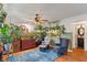 Bright living room with vibrant plants, comfortable seating, and a view into the bathroom at 3631 S 450 E, Whitestown, IN 46075