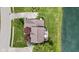 Aerial view of a house with a well-manicured lawn and a nearby pond, highlighting its prime location at 3708 Gould Dr, Carmel, IN 46033
