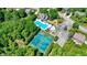 Aerial view showcases the community pool, tennis courts, and surrounding trees at 3708 Gould Dr, Carmel, IN 46033