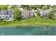 Aerial shot of a home by a pond, showcasing its well-maintained lawn and landscaping at 3708 Gould Dr, Carmel, IN 46033