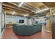 Unfinished basement with concrete floor and exposed utilities, features a comfortable sitting area at 3708 Gould Dr, Carmel, IN 46033