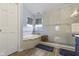 Bright bathroom featuring a soaking tub with decorative tile and a frameless shower with a bench at 3708 Gould Dr, Carmel, IN 46033