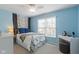 Bright bedroom featuring a bed, a window with blinds and a ceiling fan at 3708 Gould Dr, Carmel, IN 46033