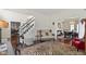 Elegant entryway features a staircase, patterned rug, and view of the dining room, creating a welcoming ambiance at 3708 Gould Dr, Carmel, IN 46033