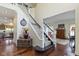 Elegant foyer with hardwood floors, a staircase, and stylish decor at 3708 Gould Dr, Carmel, IN 46033