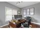 Functional home office features a wooden desk, natural light, and organized workspace, ideal for productivity at 3708 Gould Dr, Carmel, IN 46033