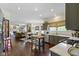 Open concept kitchen with stainless appliances and a butcher block island connects seamlessly to dining and living areas at 3708 Gould Dr, Carmel, IN 46033