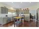 Charming kitchen with stainless steel appliances, custom cabinets, and hardwood floors at 3708 Gould Dr, Carmel, IN 46033