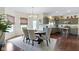 Cozy eat-in kitchen with stainless appliances, wood floors, and breakfast nook at 3708 Gould Dr, Carmel, IN 46033