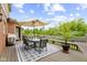 Cozy outdoor patio featuring comfortable seating and picturesque views of the lake and surrounding greenery at 3708 Gould Dr, Carmel, IN 46033