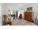Charming sitting area showcases unique furniture, a decorative rug, and access to the dining area, perfect for relaxation at 3708 Gould Dr, Carmel, IN 46033