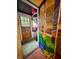 A painted front door opens to reveal an entryway with a wooden door and flooring at 3745 Winthrop Ave, Indianapolis, IN 46205