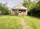 Charming home features a brick exterior, inviting front porch and a brick pathway leading to the entrance at 3745 Winthrop Ave, Indianapolis, IN 46205