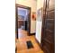 Hallway featuring hardwood floors and dark wood trim at 3745 Winthrop Ave, Indianapolis, IN 46205