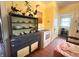 Vintage kitchen with decorative dishware on display, yellow walls, and ample storage space at 3745 Winthrop Ave, Indianapolis, IN 46205