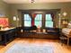 Inviting living room with hardwood floors, built-in window seat, and artistic decor at 3745 Winthrop Ave, Indianapolis, IN 46205